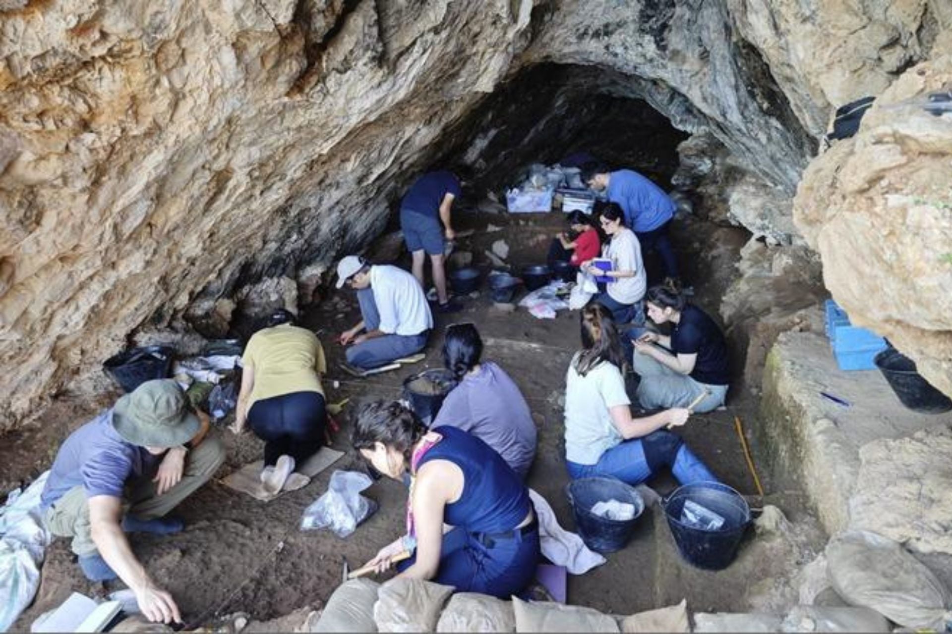 Researchers excavating Üçağızlı II Cave in southern Türkiye in 2024.