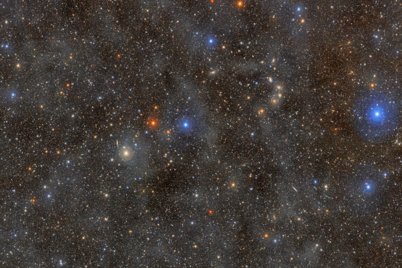 The faint, glowing clouds spread across this image are galactic cirrus: clouds of interstellar gas and dust that can be seen in the foreground of the Milky Way.