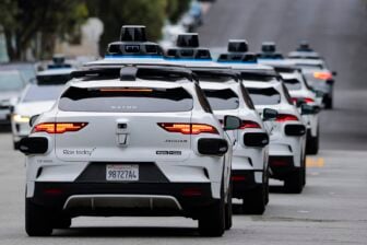 A line of Waymo robotaxis drives through North Beach on July 07, 2026 in San Francisco, California.