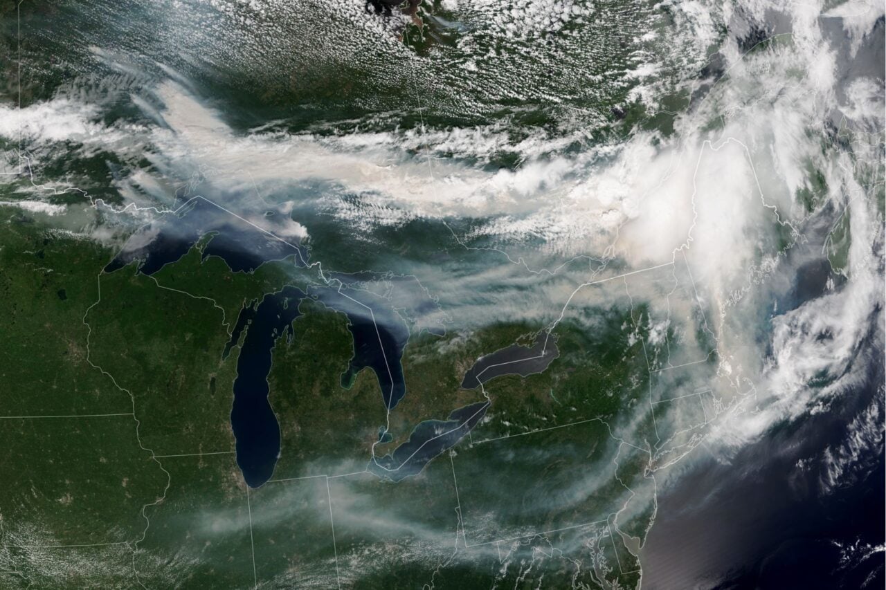 A satellite image of wildfire smoke billowing into the northeastern US from Canada