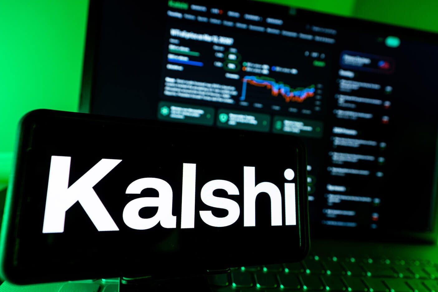 The Kalshi logo seen over an image of the site.