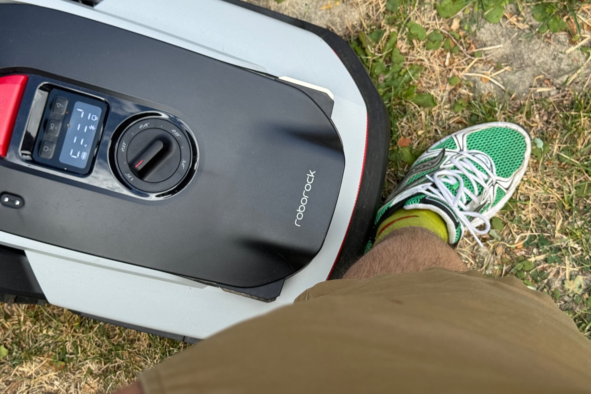 Image showing the Roborock Rockneo Q110 having bumped into a leg.