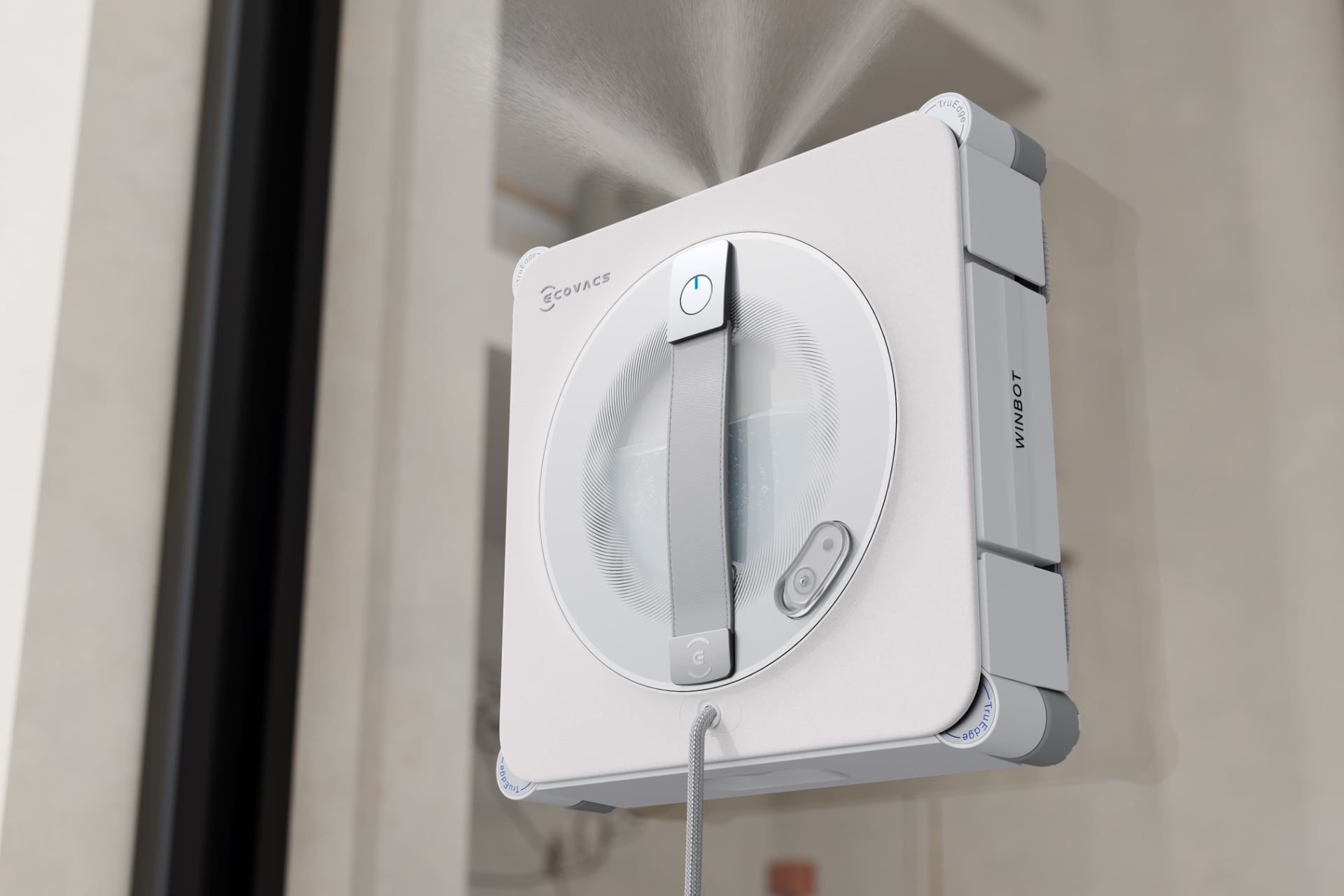 Image of the W2S Pro Omni on a window, spraying cleaning solution in front of it.