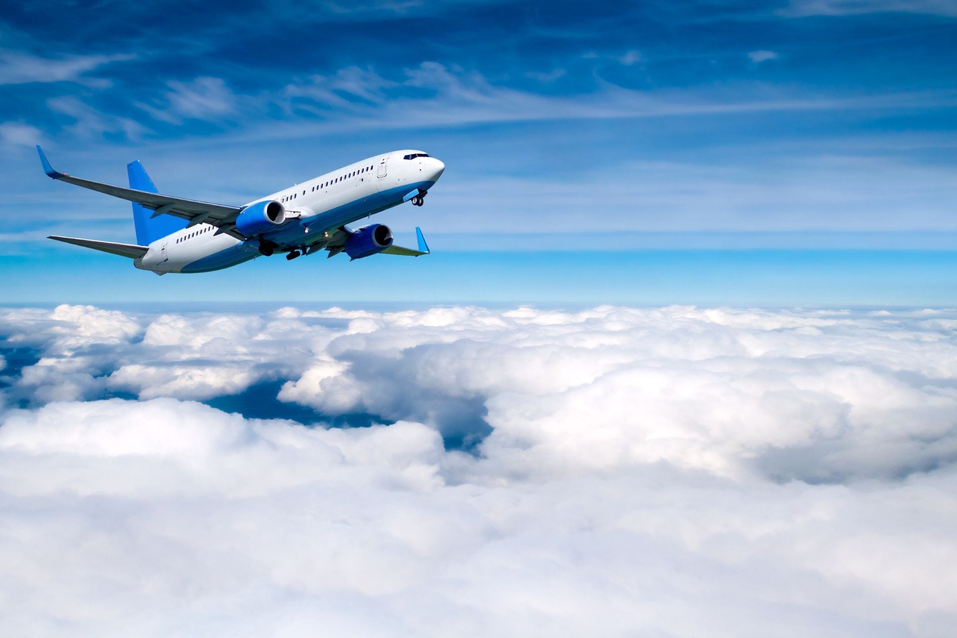 An airplane flying over the clouds.