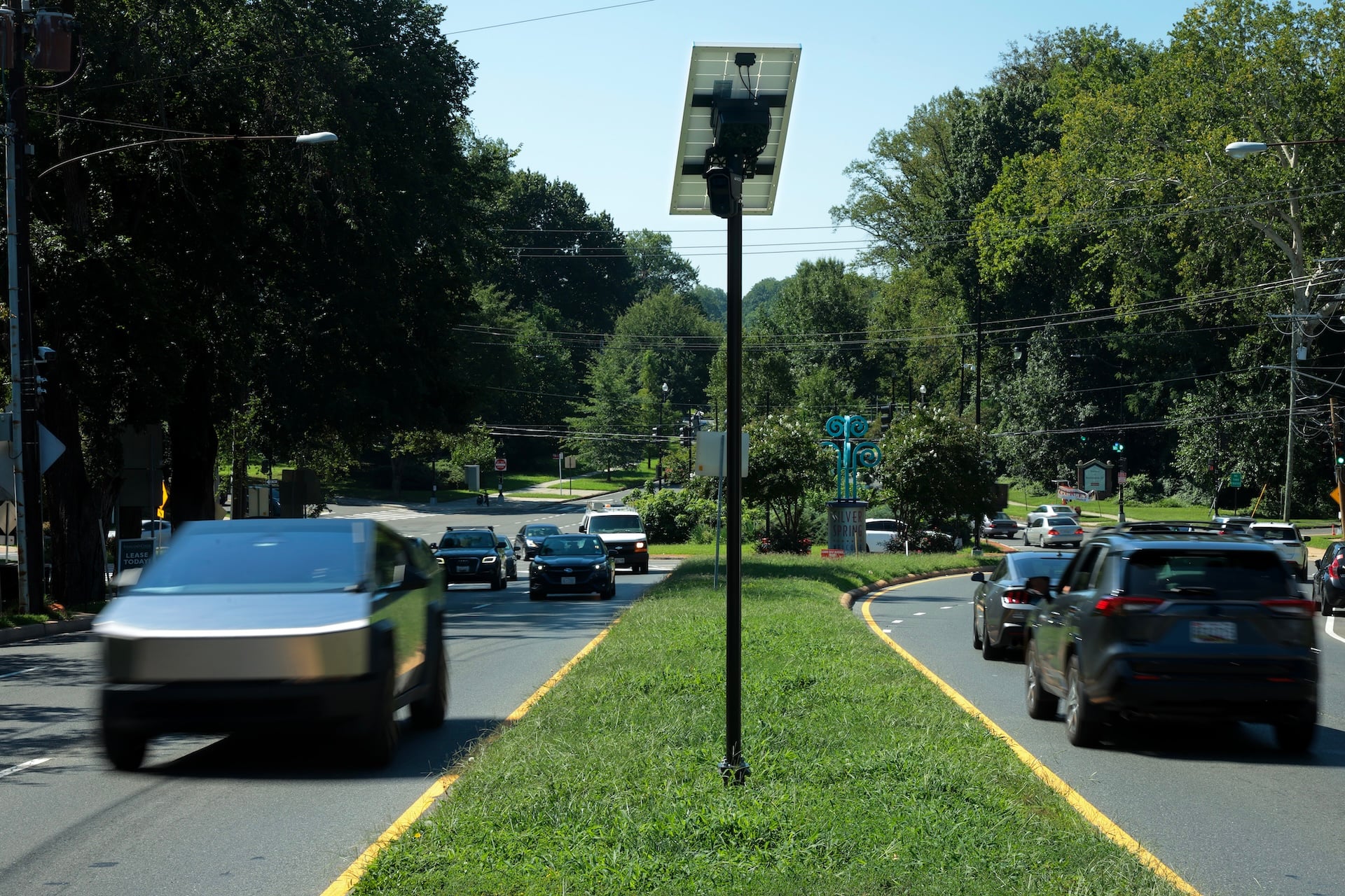 Traffic flows past an Axon brand automatic license plate reader (ALPR) camera in the median of 16th Street near the border of Maryland and the District of Columbia on August 19, 2026 in Silver Spring, Maryland.