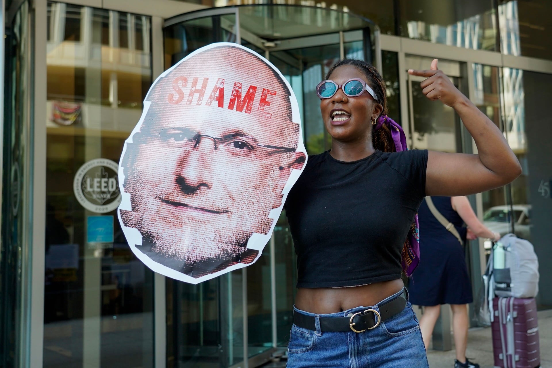 Free press advocates protest Federal Communications Commission Chairman Brendan Carr's assault on First Amendment rights, holding a series of signs that document the chairman's efforts to censor and control the media on August 06, 2026 in Washington, DC. 