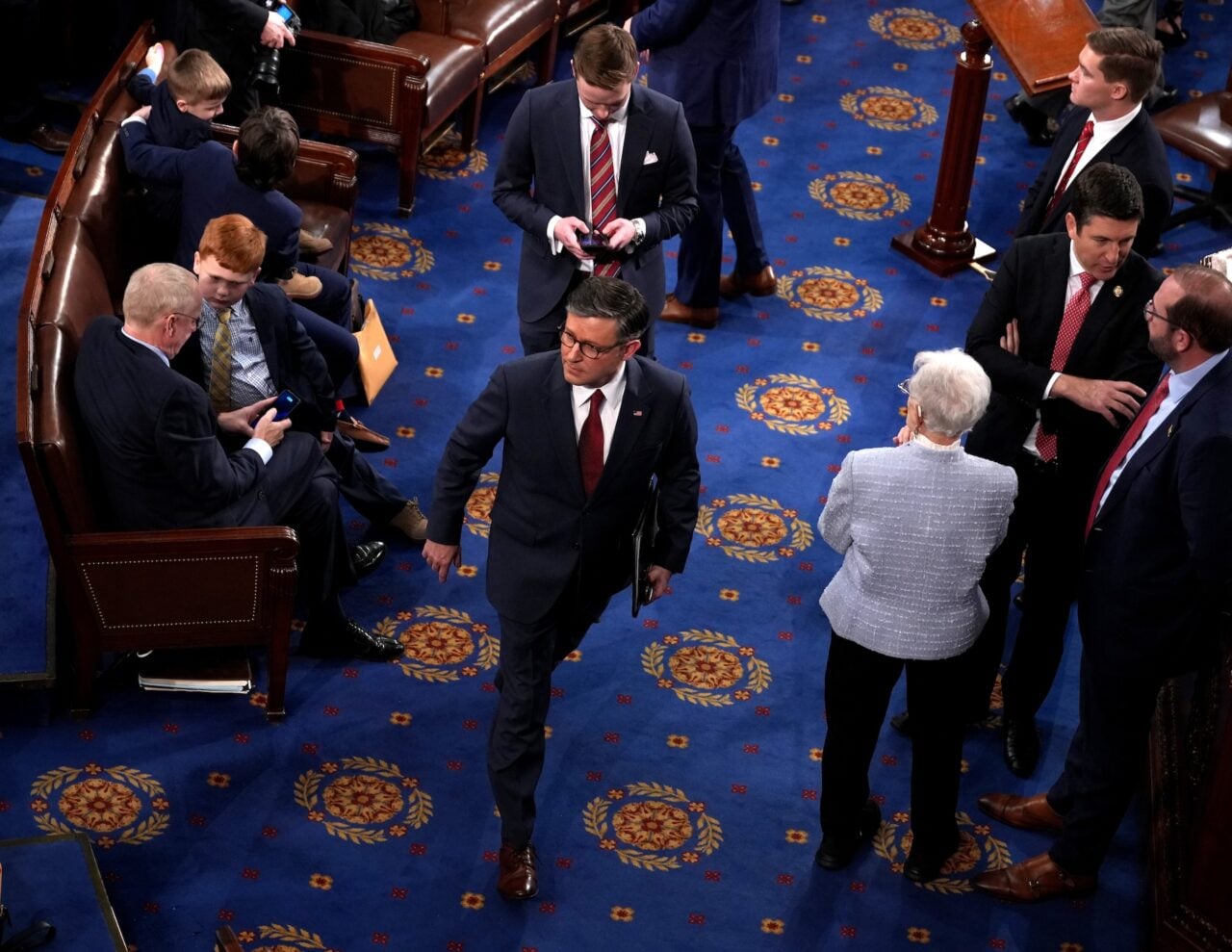 House Speaker Mike Johnson walking on the floor of Congress