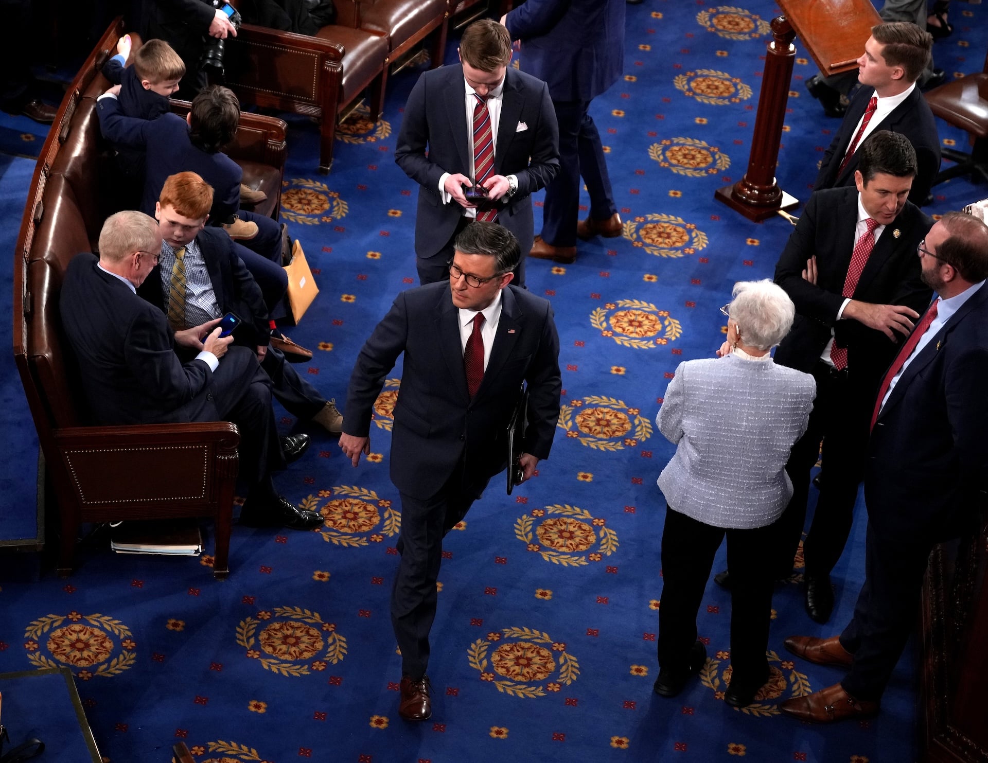 House Speaker Mike Johnson walking on the floor of Congress