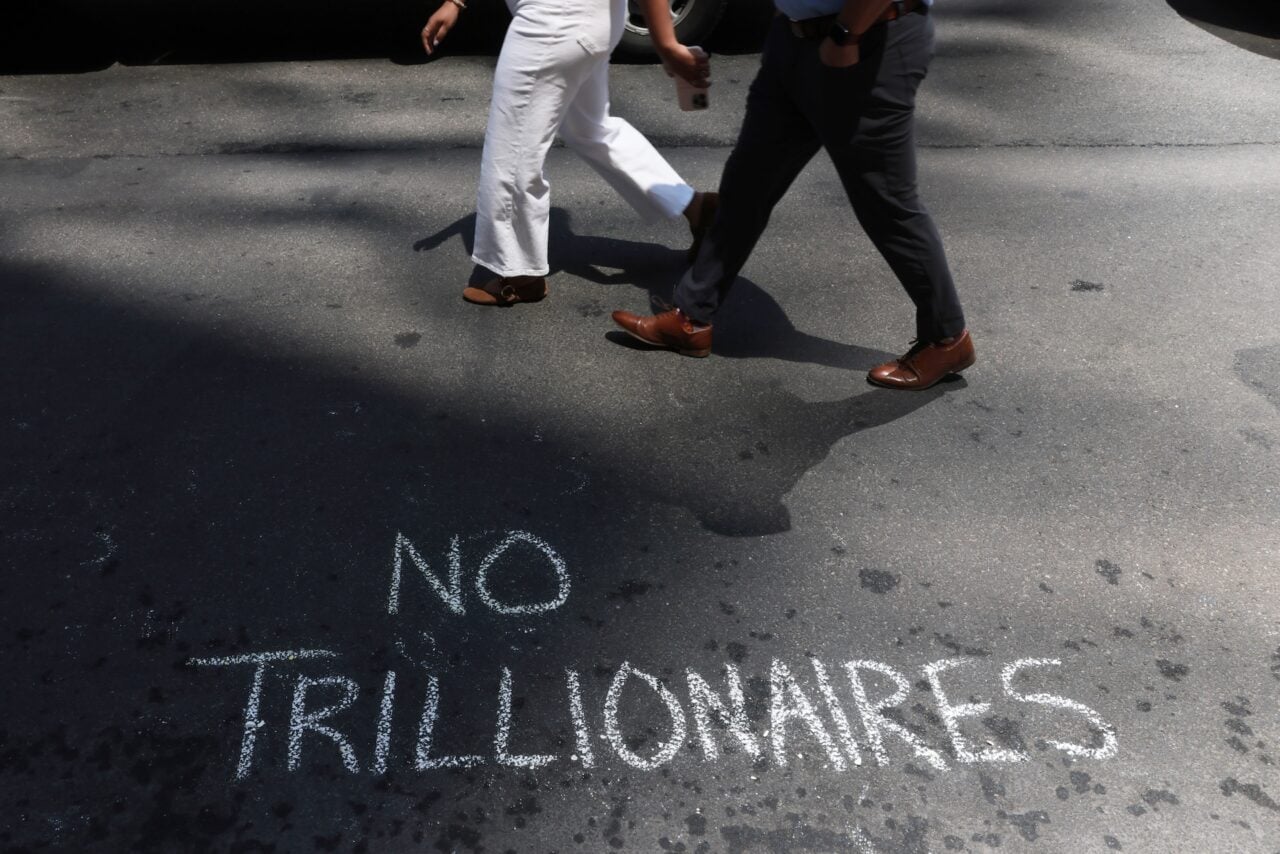 Protesters leave messages in chalk as they gather outside of JP Morgan's New York Headquarters on June 12, 2026 in New York City.