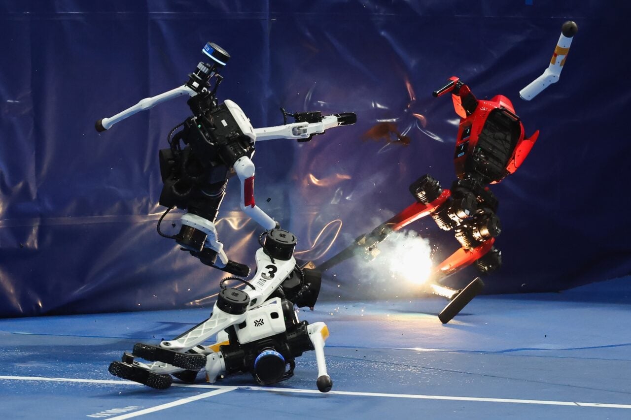 Humanoid robot collides with an obstacle and caught fire at the end of the 100 meter race during the 2nd World Humanoid Robot Games at National Speed Skating Oval on August 25, 2026 in Beijing, China.