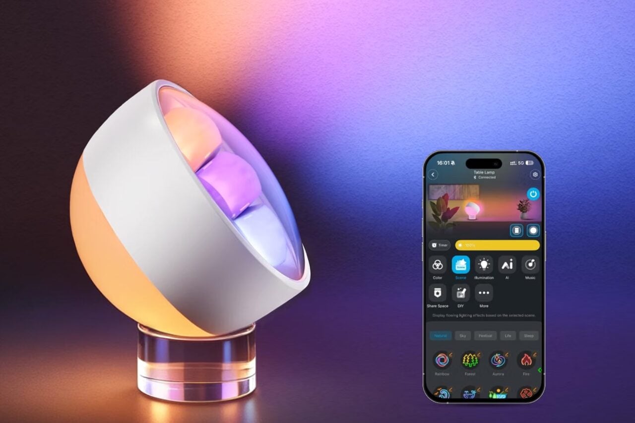 Govee Wallwasher Smart Table Lamp standing next to a smart phone.