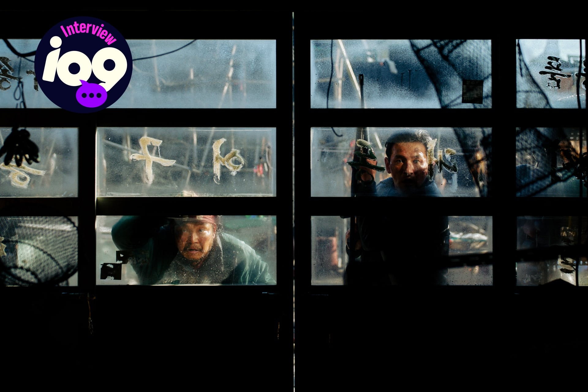 Hope still of men peering through a window.