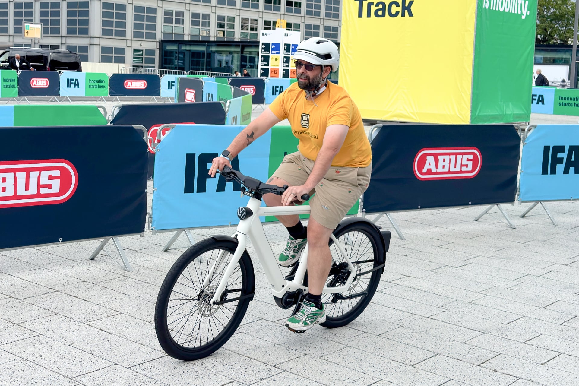 N Plus Volkswagen E Bike with the writer riding it, looking very serious.