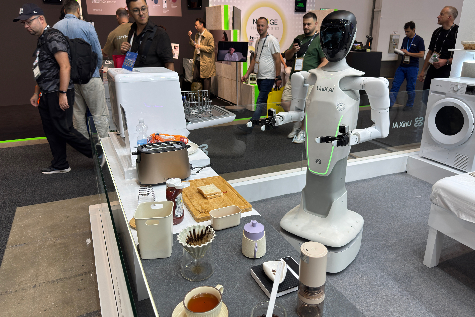 Panther robot standing in front of a makeshift breakfast station.