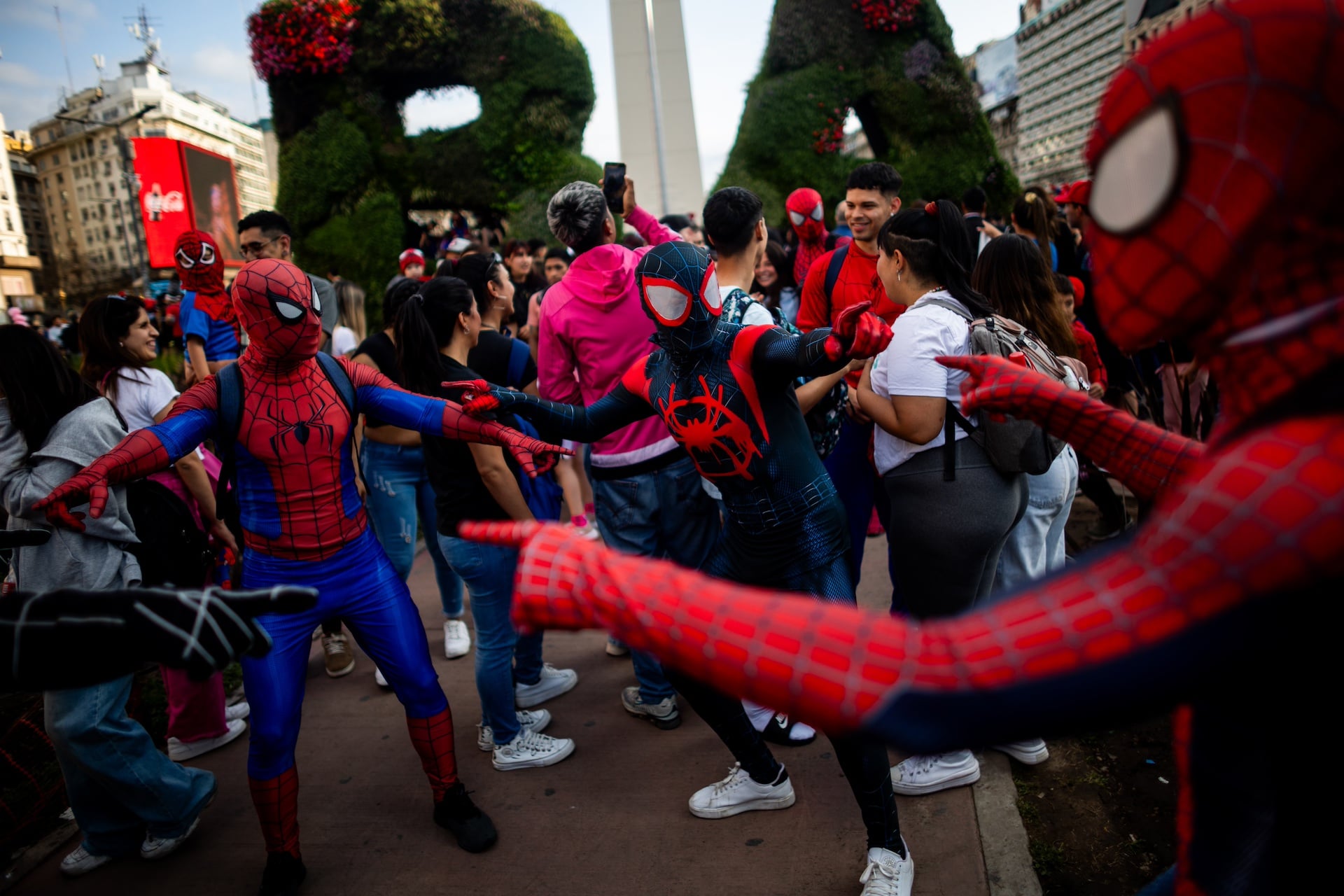 Three people recreate the famous Spider Man meme during a 2023 gathering in Buenos Aires, Argentina.