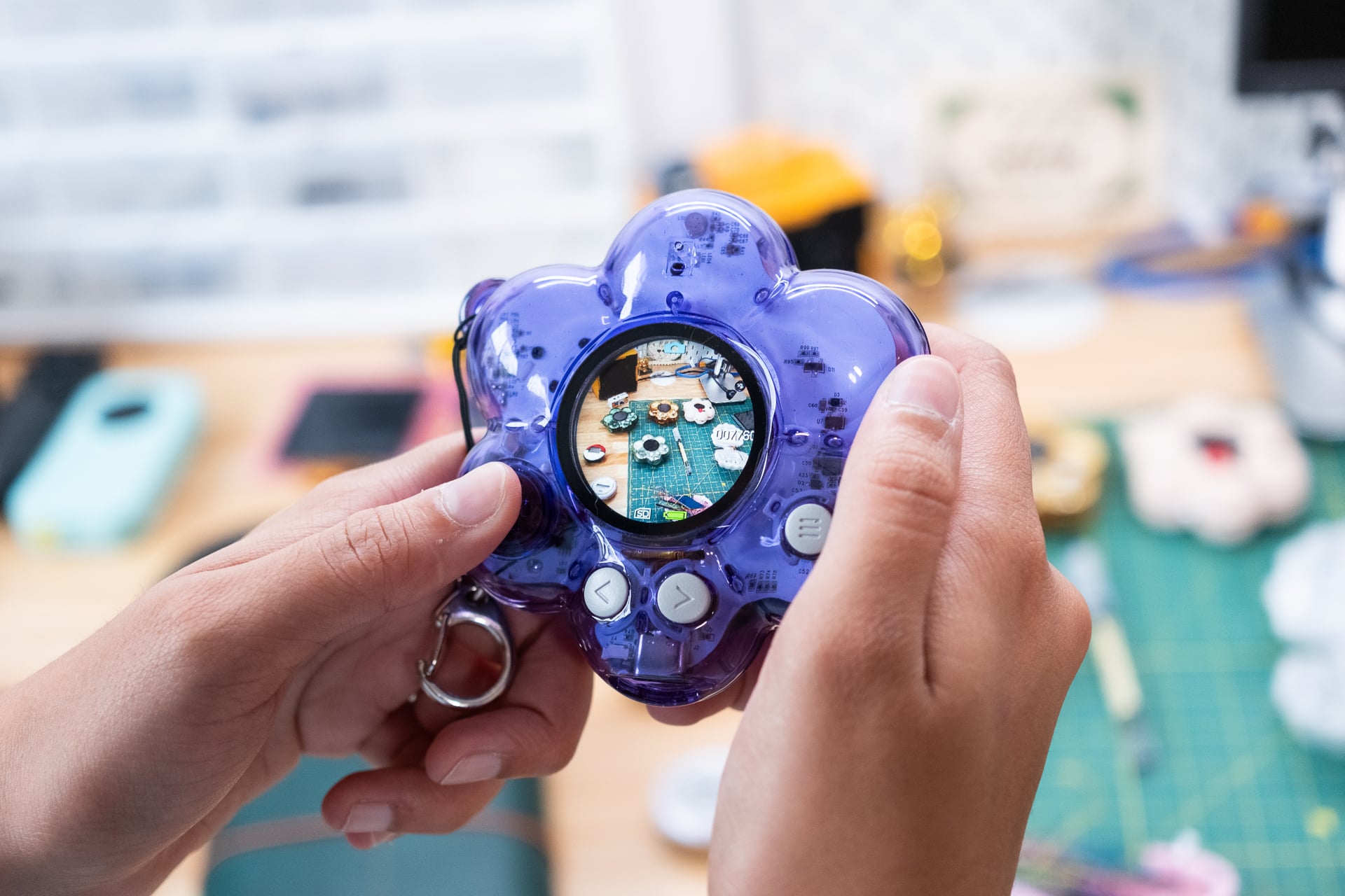 A flower camera with a circular screen made by Tru Narla.