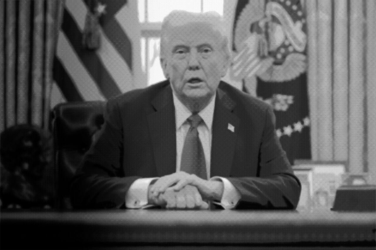U.S. President Donald Trump talks to reporters from the Resolute Desk after signing an executive order to appoint the deputy administrator of the Federal Aviation Administration in the Oval Office at the White House on January 30.