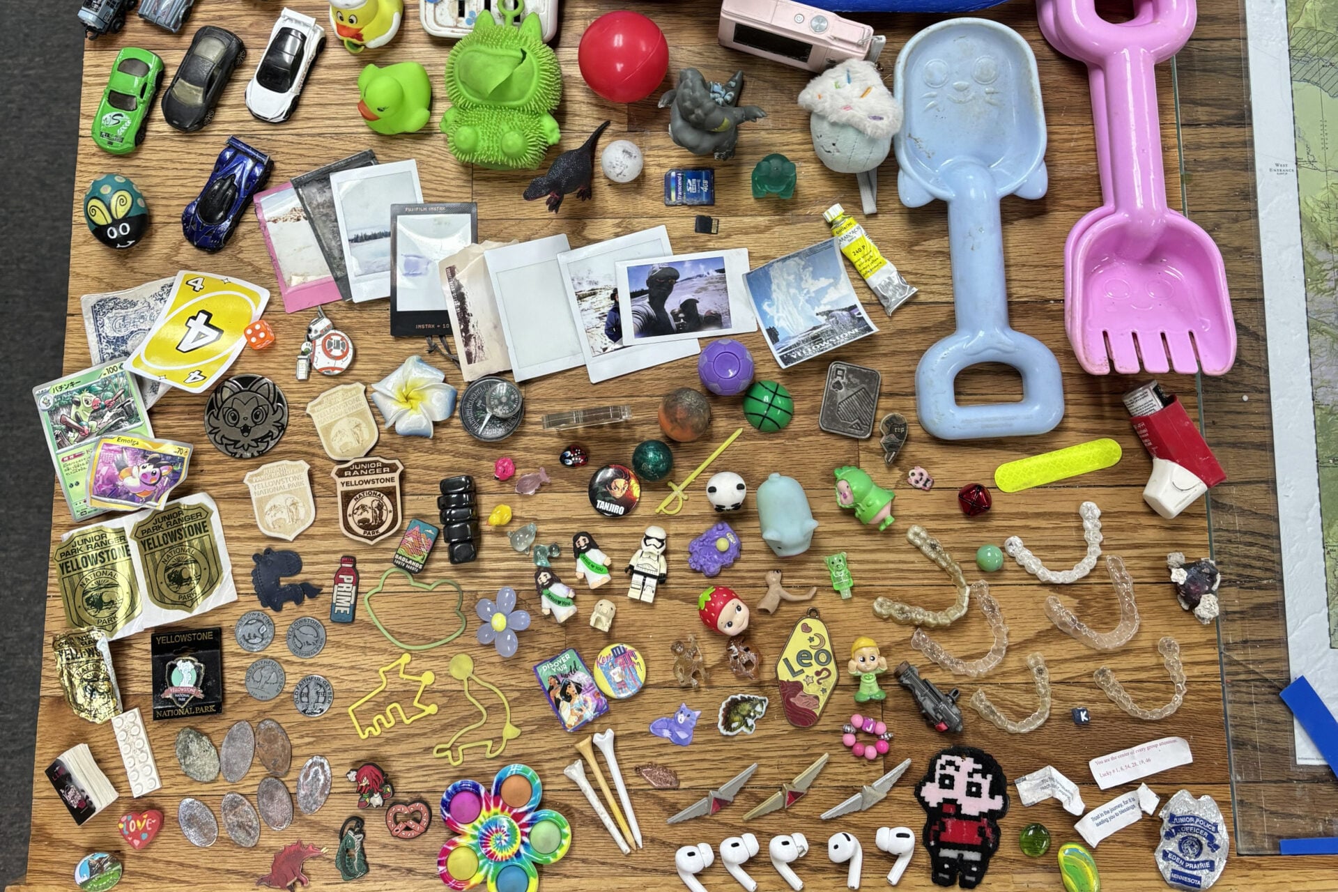 Yellowstone National Park Geology Team finds from hydrothermal areas during the 2026 summer season—including golf tees, fortune cookie fortunes, AirPods, rubber ducks, and Invisalign retainers.