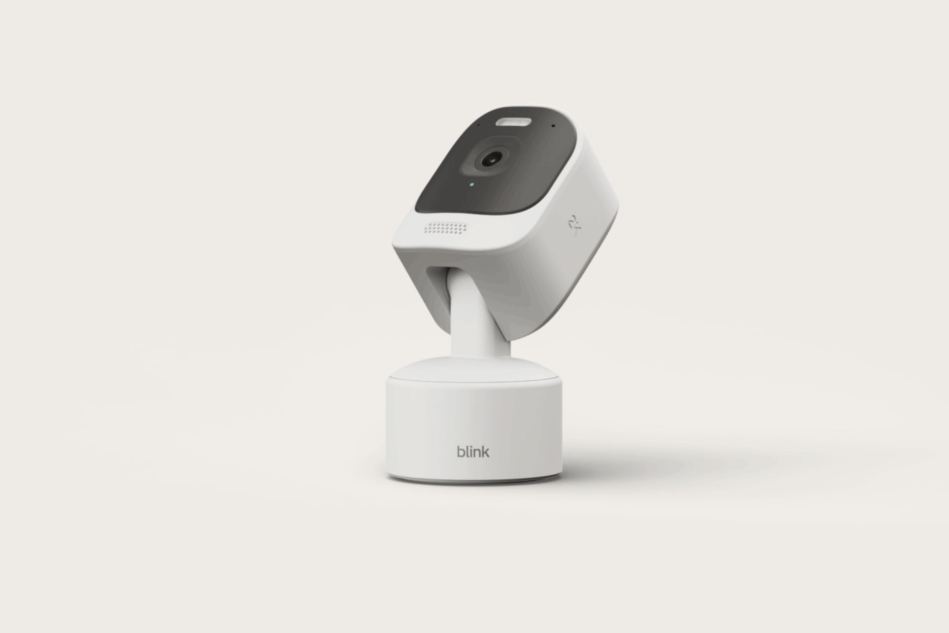Blink Mini Pan-Tilt 2K Plus sitting against a white background and tilted to look upward.