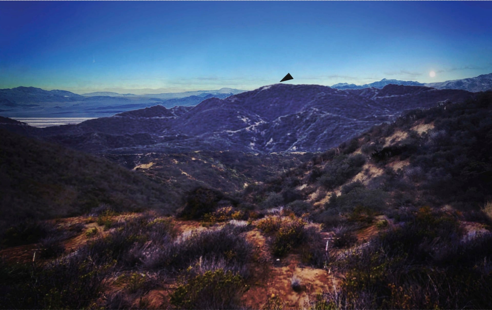 Image from an FBI report showing a black triangular shape representing a UAP spotted sometime this year.