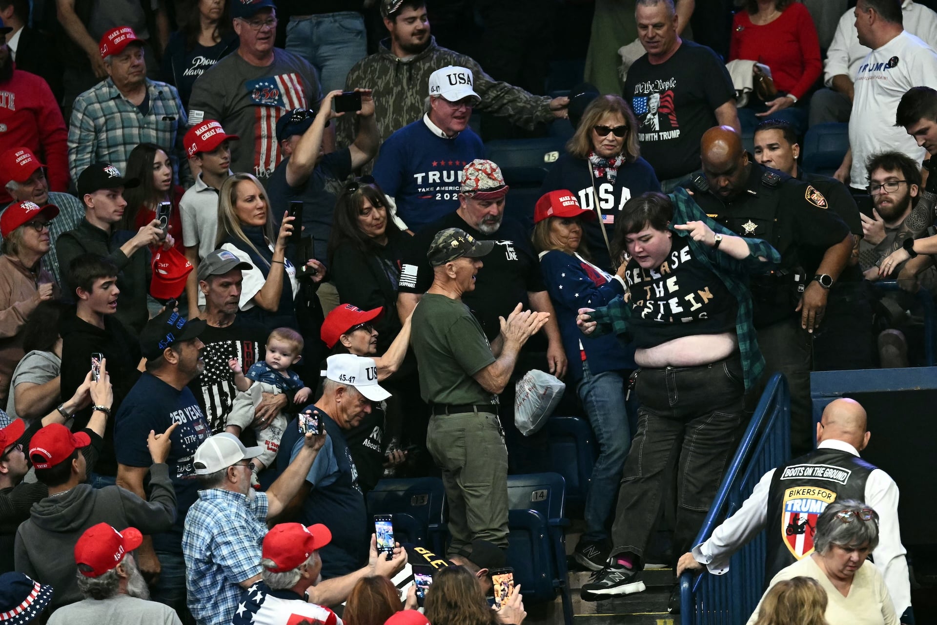 A protester is removed from the venue while US President Donald Trump speaks during a campaign rally at the Covelli Centre in Youngstown, Ohio, on October 12, 2026.