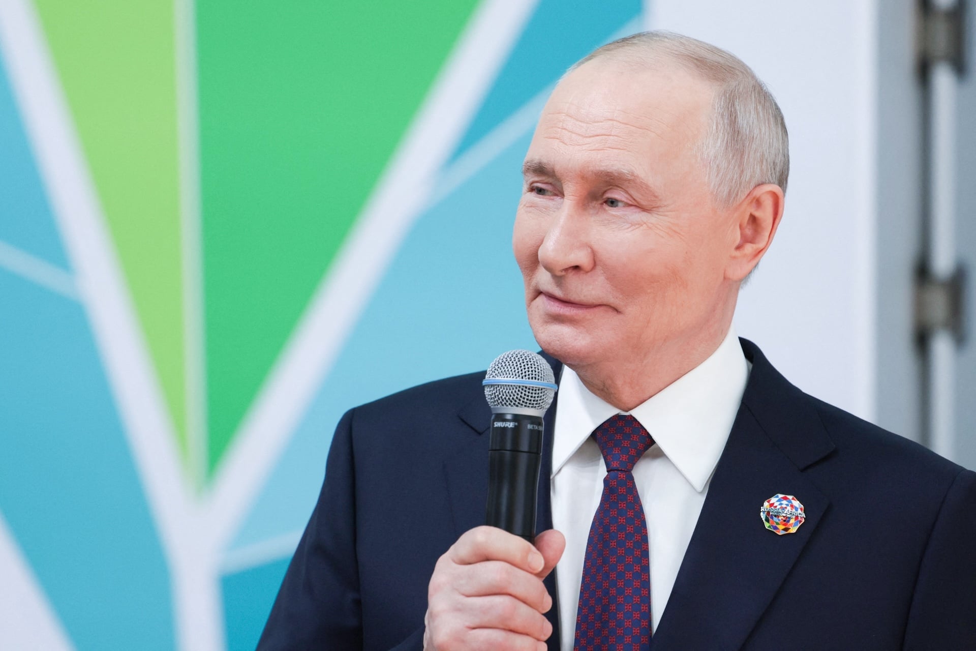 In this pool photograph distributed by the Russian state agency Sputnik, Russia's President Vladimir Putin talks as he and African leaders tour an exhibition of advanced Russian solutions on the sidelines of the Russia-Africa summit at the Gostiny Dvor conference centre in central Moscow on October 28, 2026. 