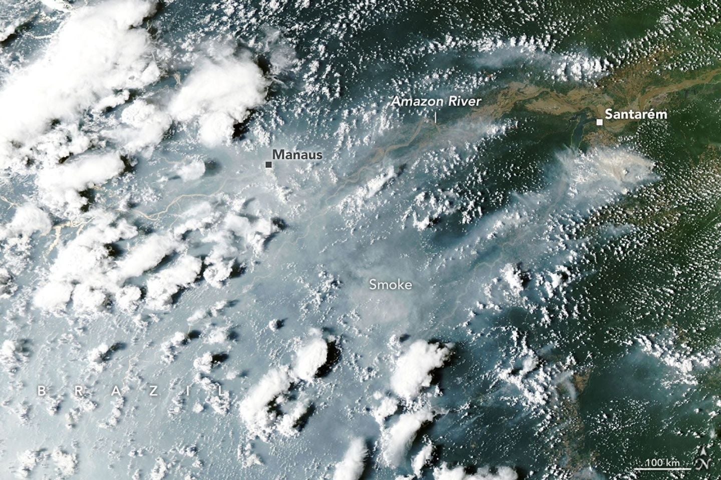 An aerial view of smoke billowing from wildfires in the Amazon Rainforest 