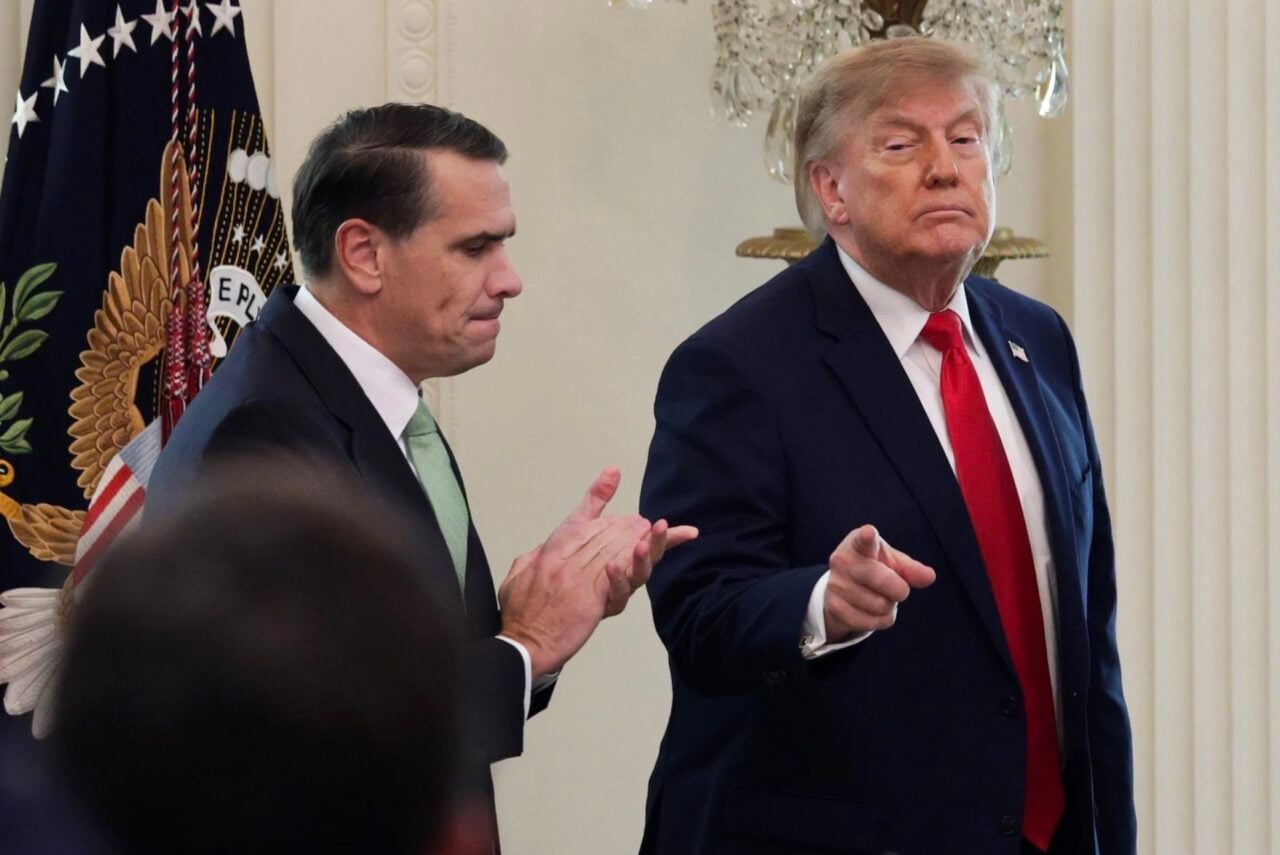 U.S. President Donald Trump gestures as he departs with U.S. Attorney General Todd Blanche (L) following a roundtable discussion on cybercrime in the East Room of the White House on October 21, 2026 in Washington, DC.
