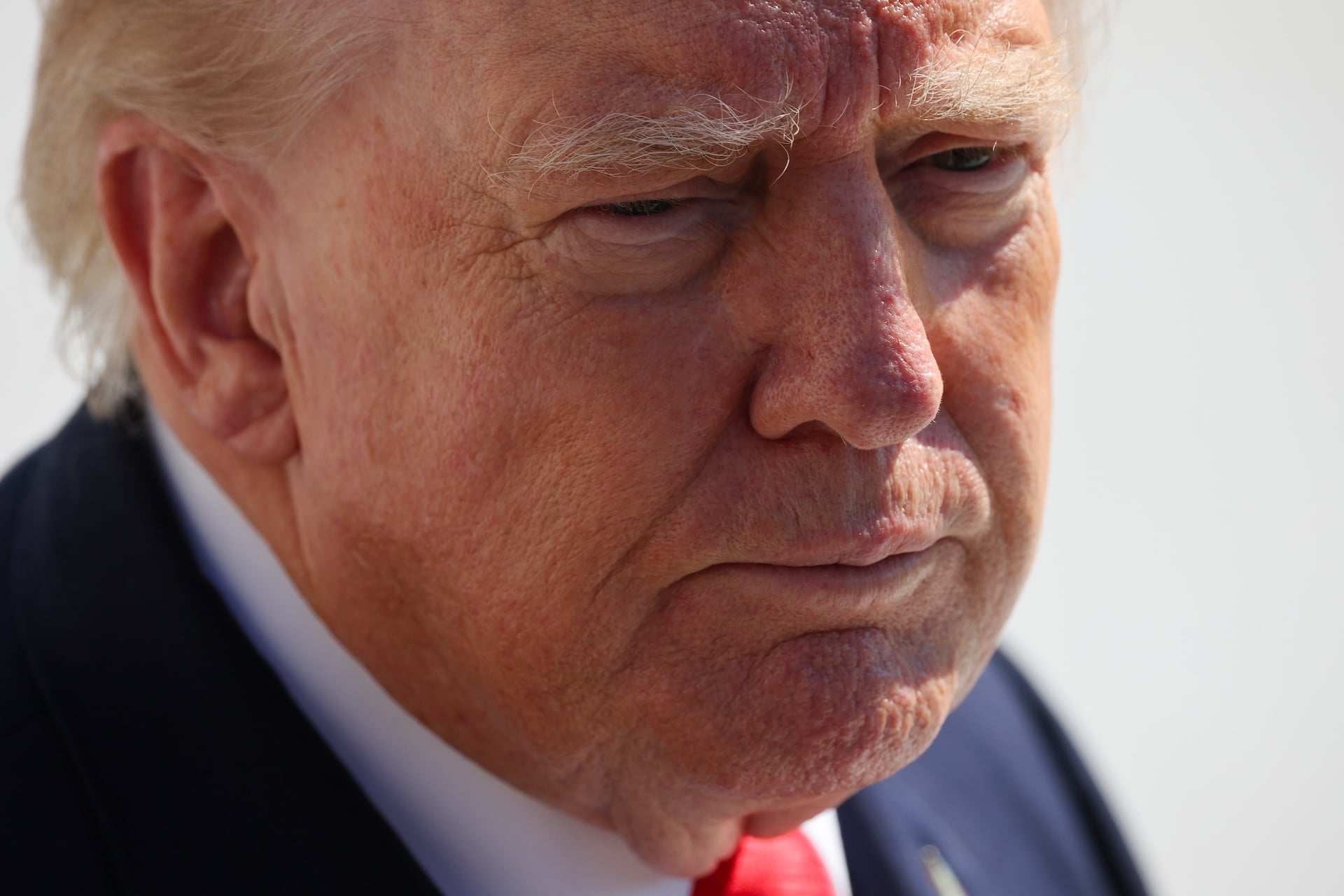 U.S. President Donald Trump stops to speak to members of the media as he departs on the South Lawn of the White House on October 13, 2026 in Washington, DC.  